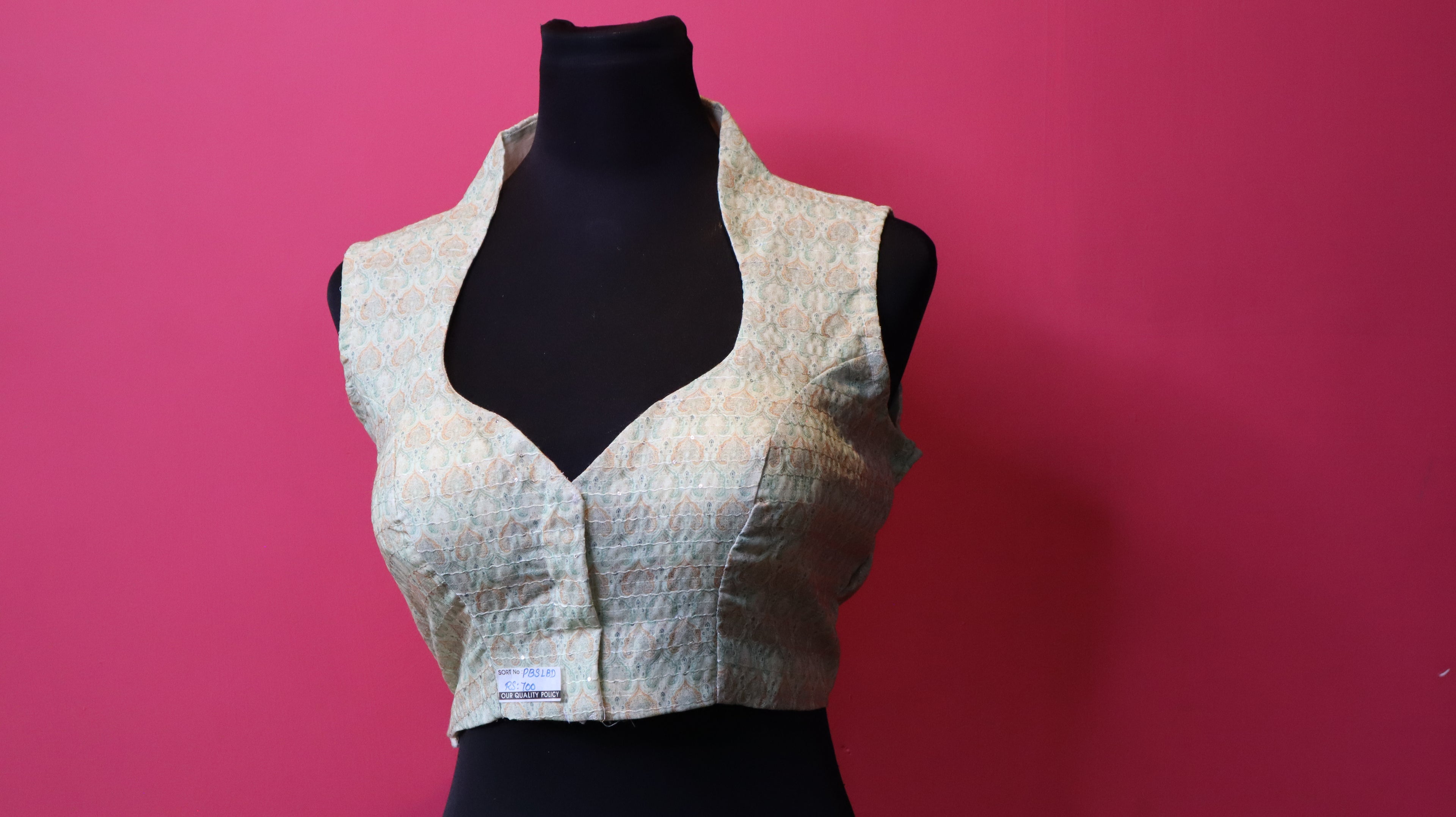 Elegant Designer Sleeveless Blouse – Soft Pastel Traditional Pattern