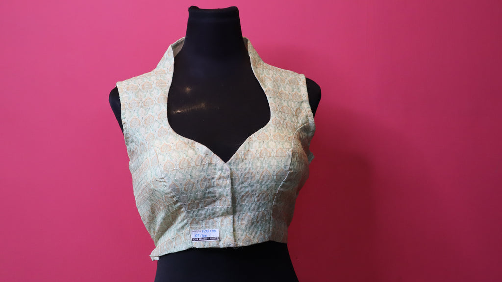 Elegant Designer Sleeveless Blouse – Soft Pastel Traditional Pattern