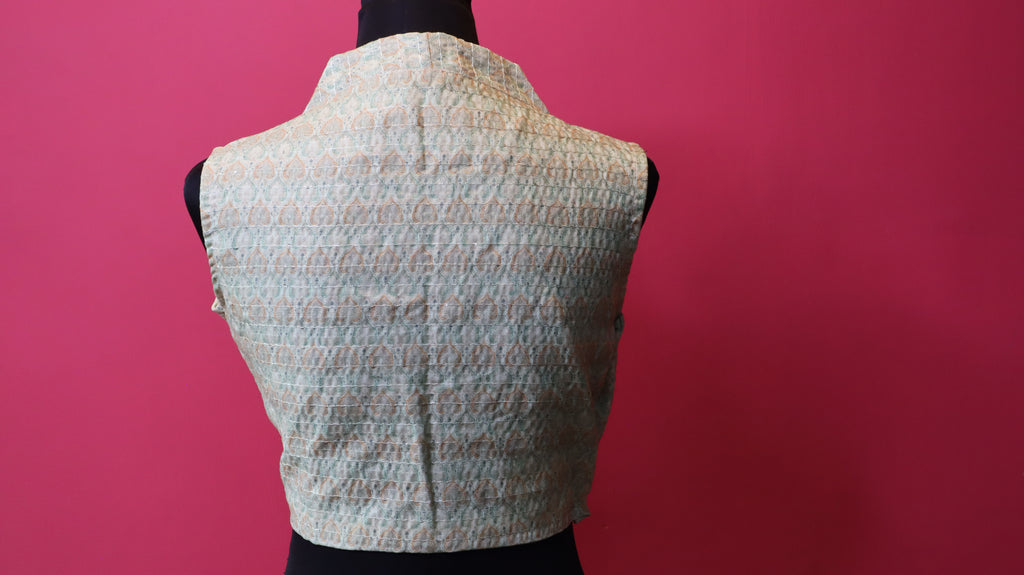 Elegant Designer Sleeveless Blouse – Soft Pastel Traditional Pattern
